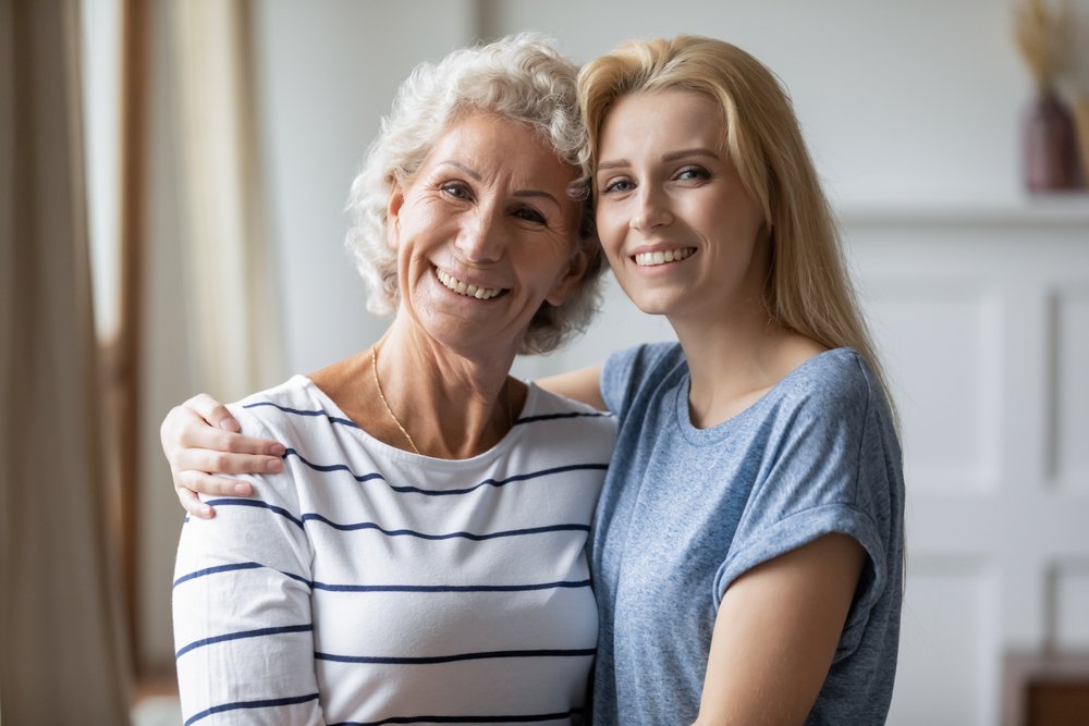 Happy Mature Mom And Adult Daughter Hugging Stock Image